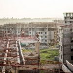 Two construction workers in Koye, the largest condominium site under construction outside Addis Abeba. Photograph: Charlie Rosser