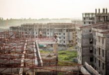 Two construction workers in Koye, the largest condominium site under construction outside Addis Abeba. Photograph: Charlie Rosser