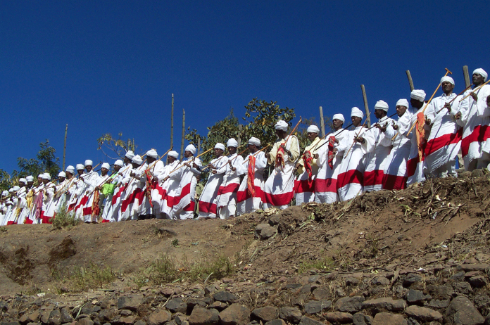 The clergy and Debtera (scholars versed in the liturgy and music of the church) lift their voices in hymn and chant just as it has been for over a 1,500 years when Ethiopia accepted Christianity.