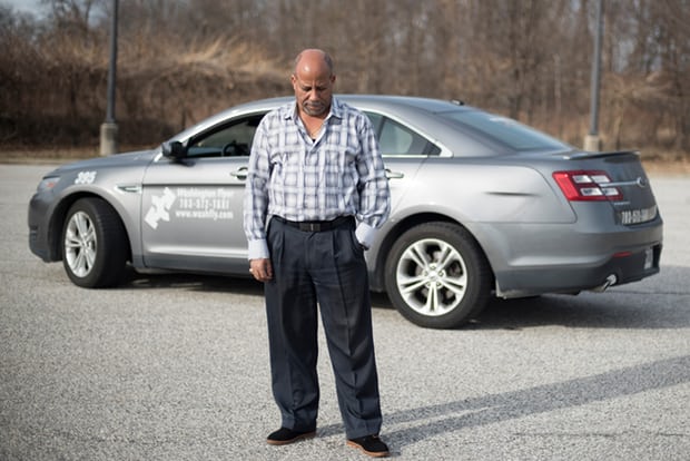 Hailu Mergia today, pictured in front of his cab. Photograph: Sait Serkan Gurbuz for the Guardian